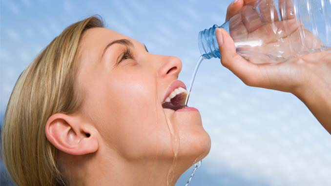 Woman Drinking Water From A Bottle