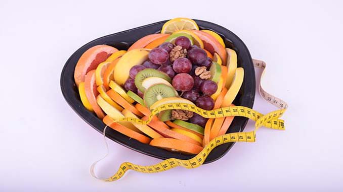 A Variety Of Fruit In A Heart Shaped Bowl