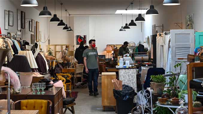 People Shopping At A Thrift Store