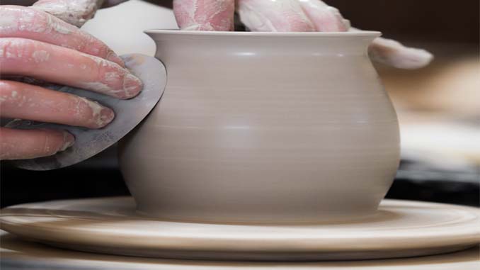 Pot Being Sculpted On A Wheel