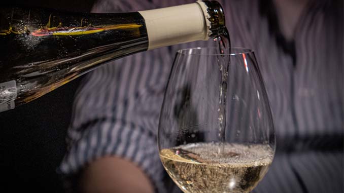 Wine Being Poured Into A Glass