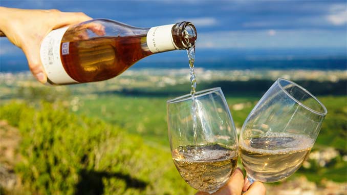 Wine Being Poured Into Glasses