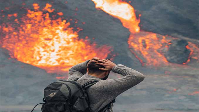 Man Watching A Lava Spill