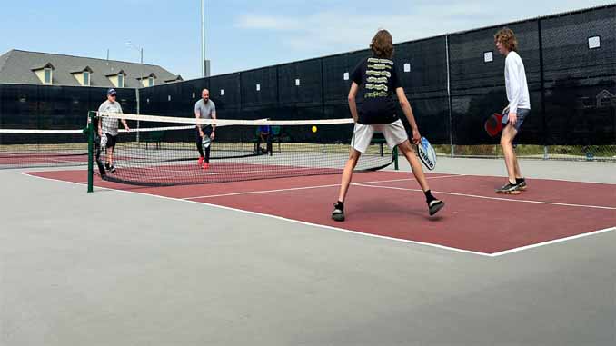 Four Men Playing Pickleball