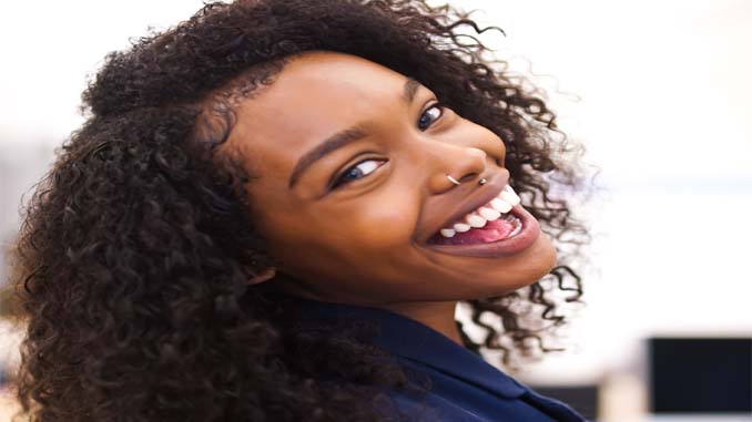 Smiling Woman Looking Over Her Shoulder