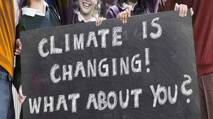 Sign Reading "Climate Is Changing! What About You"