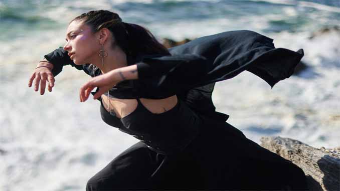 Woman Dancing By The Water