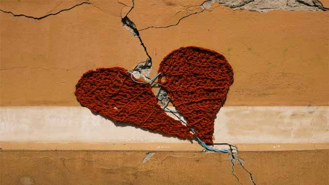 Two Halves Of A Crocheted Heart Stitched Back Together