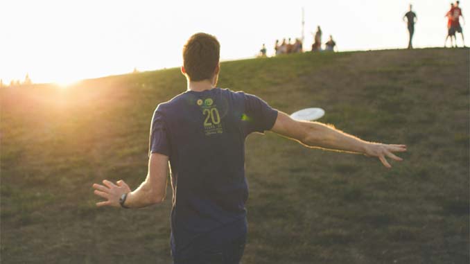 Male Throwing A Frisbee