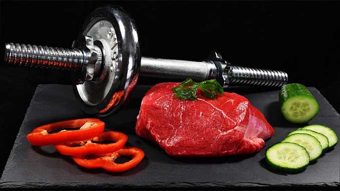 Raw Meat On A Cutting Board With Chopped Bell Peppers And Cucumbers