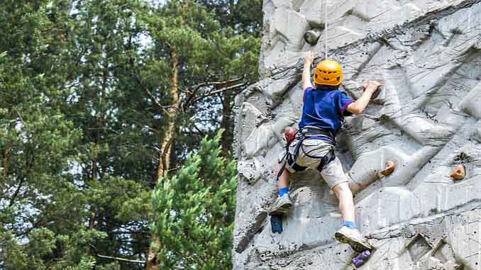 A Boy Rock Climbing