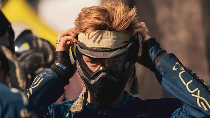 Player Adjusting His Head Gear