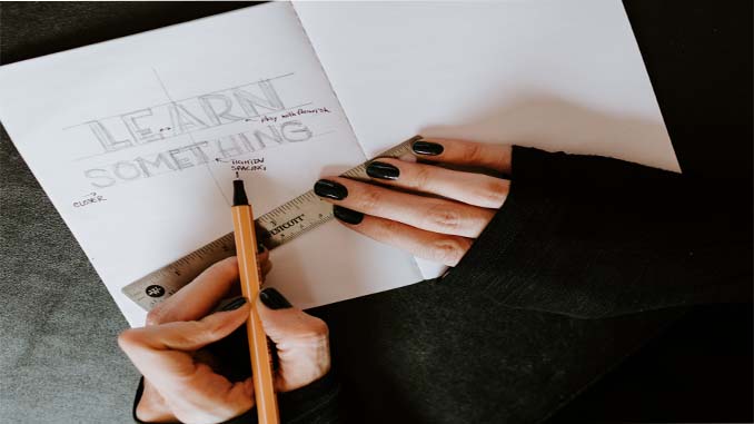Woman Drawing In Her Notebook "Learn Something"