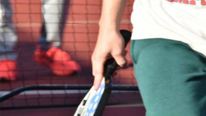 Woman On A Pickleball Court