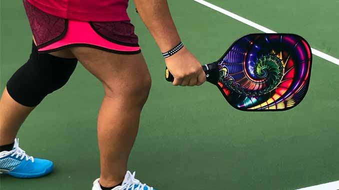 Woman Holding Colorful Pickleball Paddle