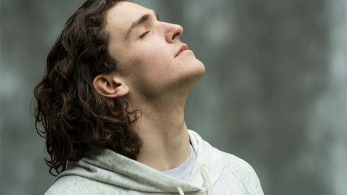 Man With Closed Eyes And Tilted Head