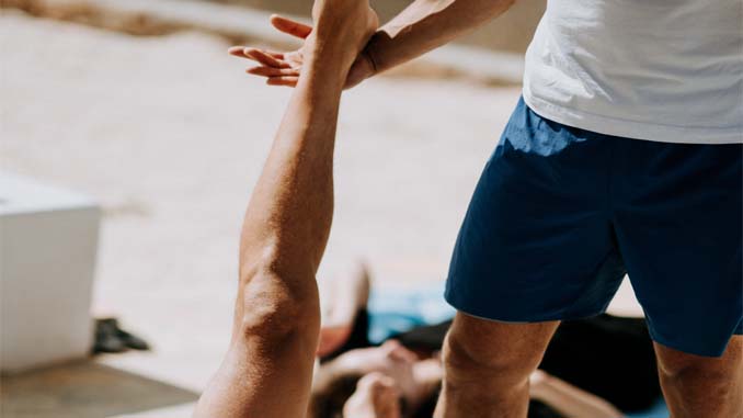 Physiotherapist Working On A Patient