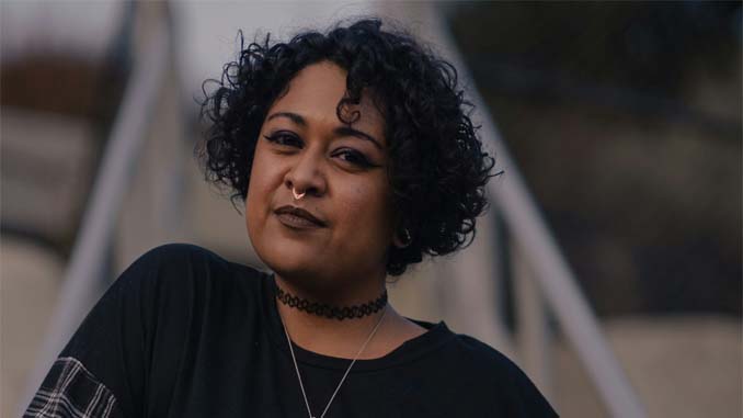 Woman Standing On A Bridge