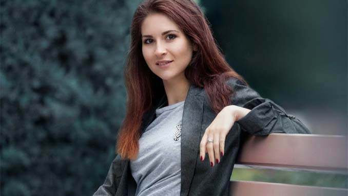 Woman Sitting On A Park Bench