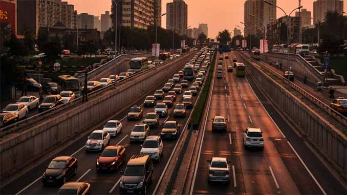 Cars On The Road At Sunset