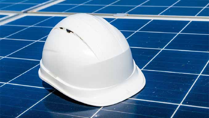 A Hard Hat On A Solar Panel
