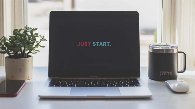 A Laptop Monitor Reading "Just Start"