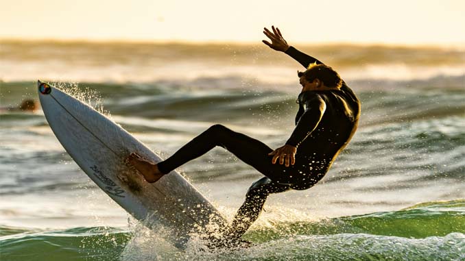 Man On Surfboard About To Wipe Out