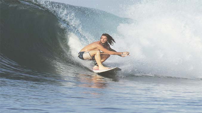 Man Riding A Wave