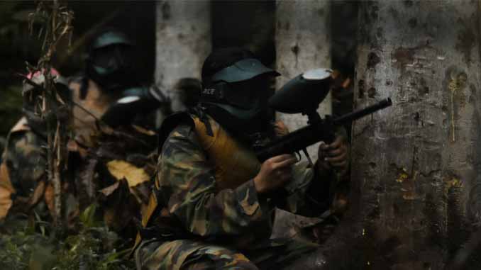 Two Players Hiding Behind A Tree