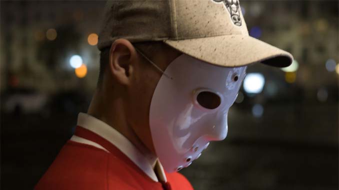 Man With Ball Cap Wearing A Mask