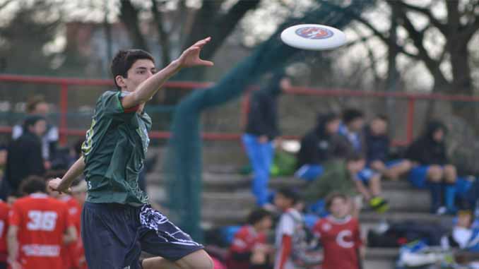 Young Male Catching A Frisbee
