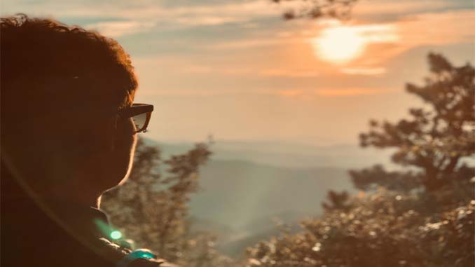 Woman Enjoying A Sunset