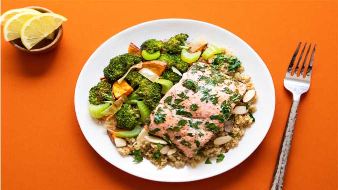 A Plate With Salmon And Veggies