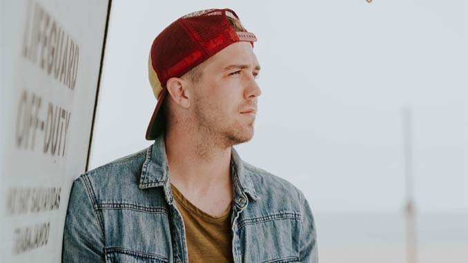 Man Contemplating Life At The Beach