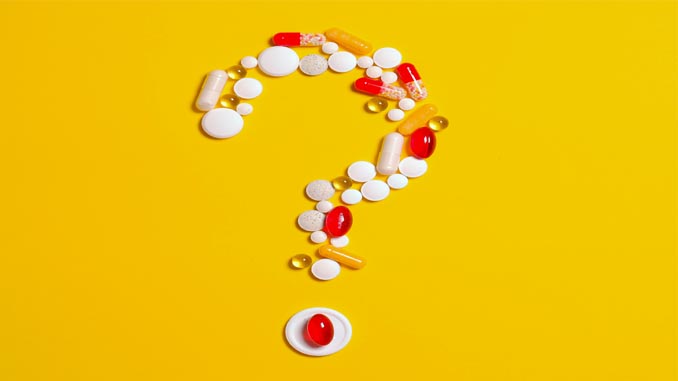 Various Supplements Laid Out As A Question Mark