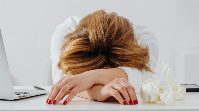 Woman With Her Head On A Table